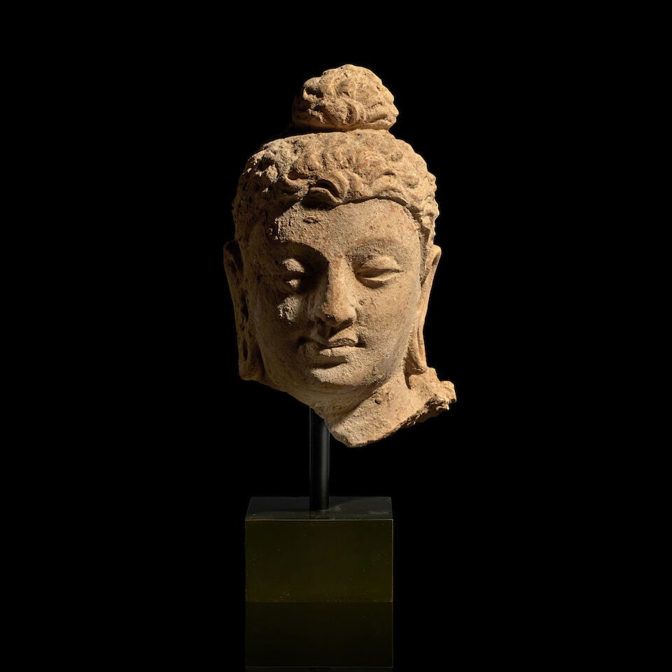 A STUCCO HEAD OF THE BUDDHA ANCIENT REGION OF GANDHARA, 3RD-5TH CENTURY: A STUCCO HEAD OF THE BUDDHA ANCIENT REGION OF GANDHARA, 3RD-5TH CENTURY 5 1/2 in. (14 cm) high Footnotes: 犍陀罗 三/五世紀 泥塑佛首 Pu