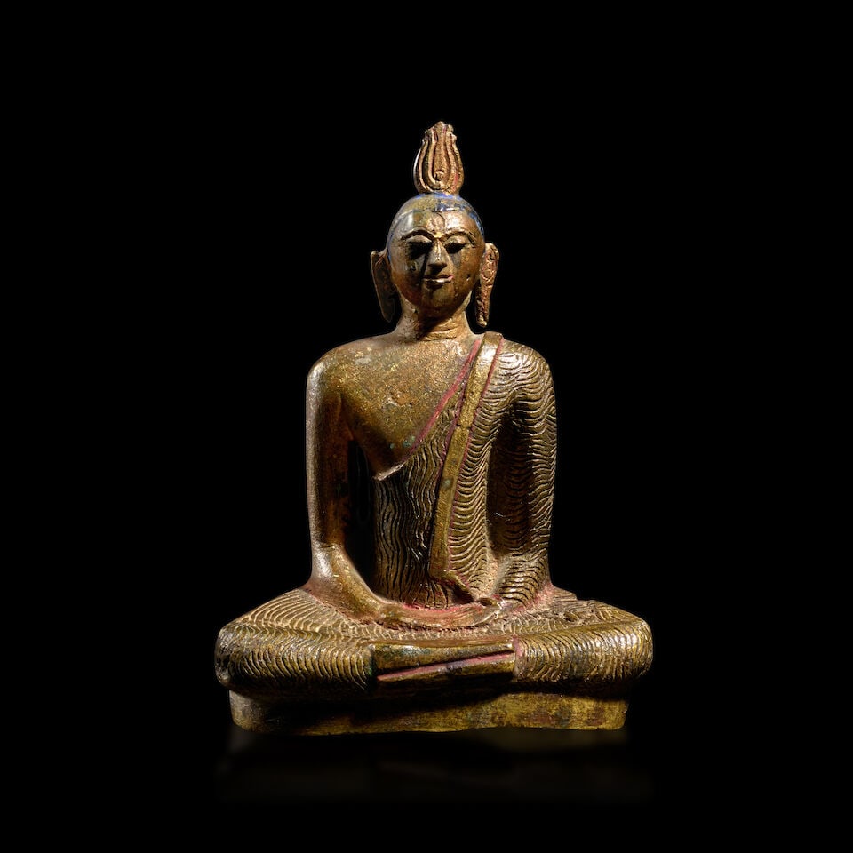 A COPPER ALLOY FIGURE OF BUDDHA SRI LANKA, KANDYAN PERIOD, 18TH CENTURY (1 of 2)