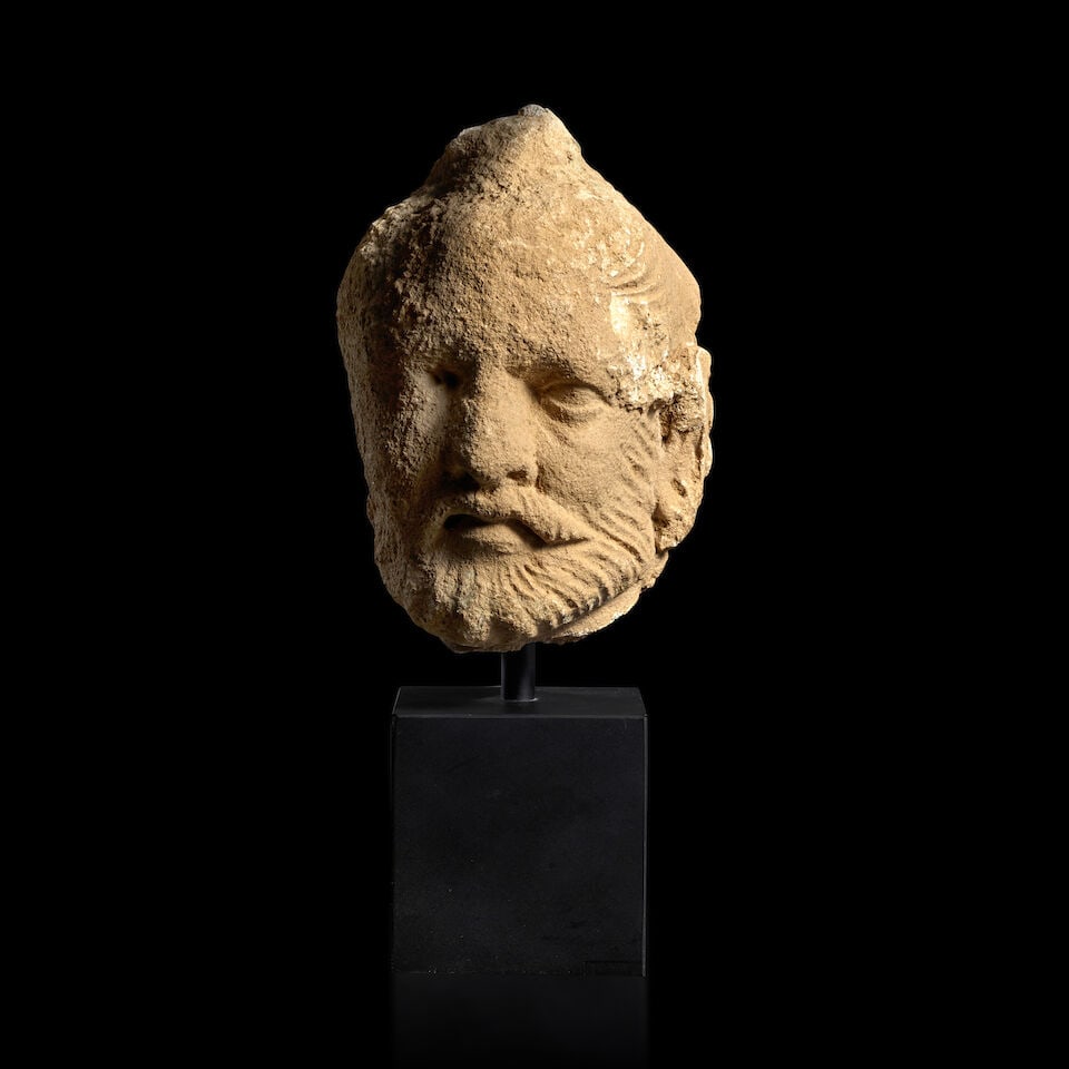 A STUCCO HEAD OF AN ASCETIC ANCIENT REGION OF GANDHARA, 3RD-5TH CENTURY: A STUCCO HEAD OF AN ASCETIC ANCIENT REGION OF GANDHARA, 3RD-5TH CENTURY 5 7/8 in. (15 cm) high Footnotes: 犍陀羅 三/五世紀