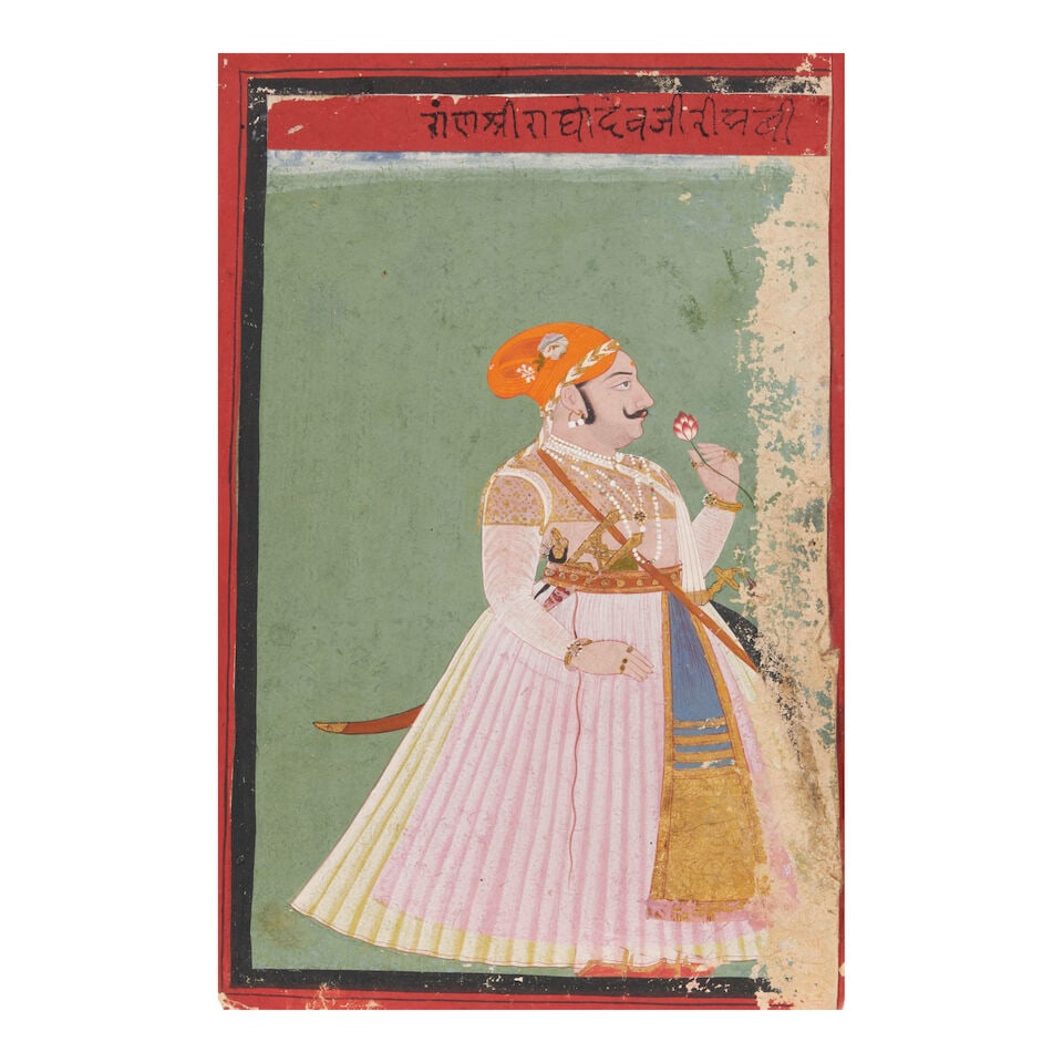 A PORTRAIT OF A NOBLEMAN MEWAR, LATE 18TH CENTURY: A PORTRAIT OF A NOBLEMAN MEWAR, LATE 18TH CENTURY With an inscription in the top border identifying the figure as 'Ragho Deva ji'. Image: 8 3/8 x 5 1/4 in. (21.3 x 13.3 cm) Folio: 9 1/2 x 6 in.