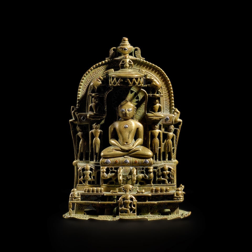 A COPPER AND SILVER INLAID COPPER ALLOY JAIN SHRINE WESTERN INDIA, CIRCA 1426: A COPPER AND SILVER INLAID COPPER ALLOY JAIN SHRINE WESTERN INDIA, CIRCA 1426 The back inscribed and dated Samvat 1483 (1426 CE) 7 1/8 in. (18.1 cm) high Footnotes: Provenance Sotheby Parke