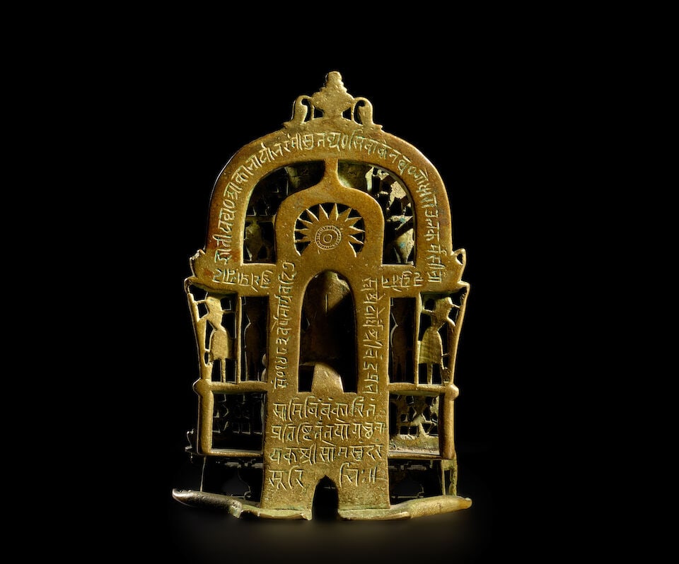 A COPPER AND SILVER INLAID COPPER ALLOY JAIN SHRINE WESTERN INDIA, CIRCA 1426 - 2