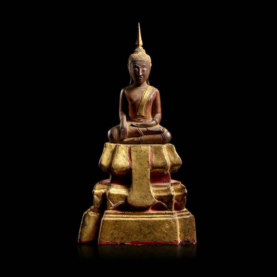 A PARCEL-GILT LACQUERED SANDALWOOD FIGURE OF BUDDHA THAILAND, 18TH/19TH CENTURY: A PARCEL-GILT LACQUERED SANDALWOOD FIGURE OF BUDDHA THAILAND, 18TH/19TH CENTURY 11 1/4 in. (28.6 cm) high Footnotes: 泰國 十八/十九世紀