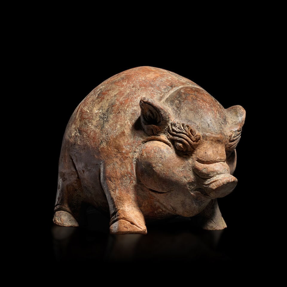 A TERRACOTTA BOAR-SHAPED MONEY BOX INDONESIA, EASTERN JAVA, MAJAPAHIT KINGDOM, 15TH CENTURY: A TERRACOTTA BOAR-SHAPED MONEY BOX INDONESIA, EASTERN JAVA, MAJAPAHIT KINGDOM, 15TH CENTURY 6 3/4 in. (17.2 cm) high; 8 1/2 in. (21.6 cm) long Footnotes: 印度尼西亞 Ĉ