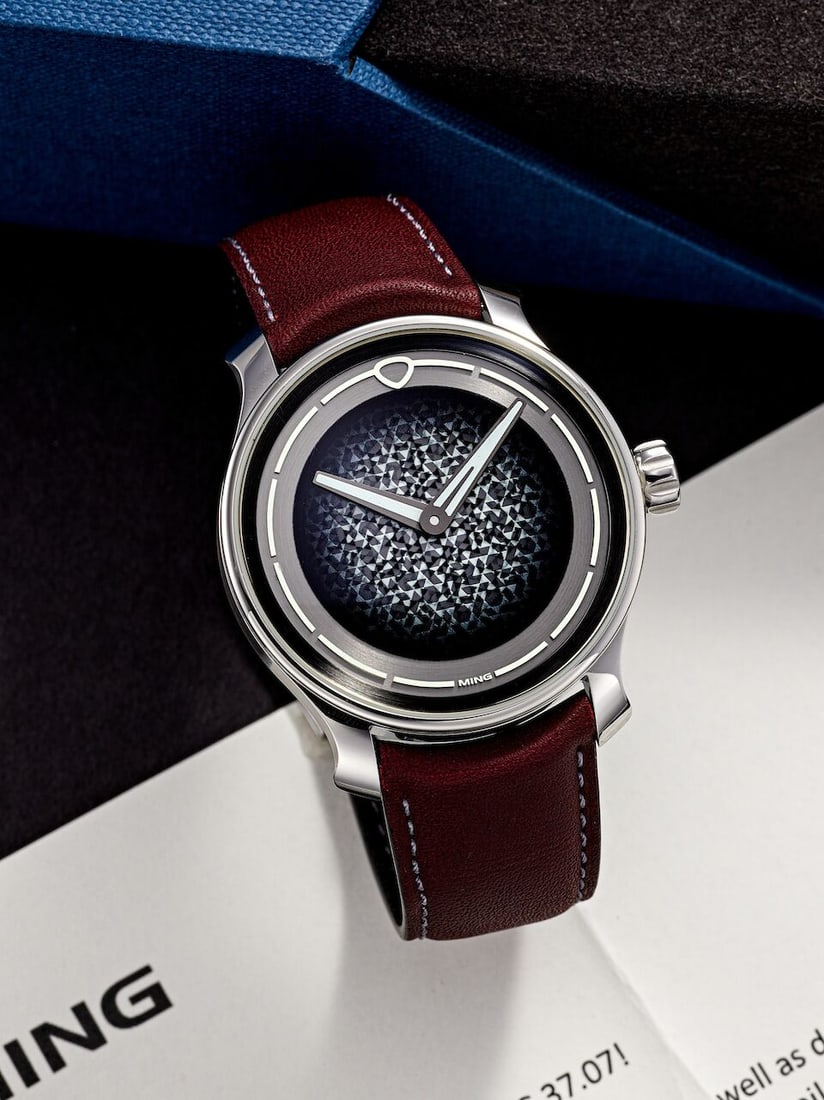 [NO RESERVE] MING | MOSAIC, REF.37.07, A BRAND NEW STAINLESS STEEL WRISTWATCH, CIRCA 2025: [NO RESERVE] MING | MOSAIC, REF.37.07, A BRAND NEW STAINLESS STEEL WRISTWATCH, CIRCA 2025 Case No: 011133 Calibre: SW210.M1, manual winding, signed Dial: Grey with mosiac motif, signed Case: 38mm, sta