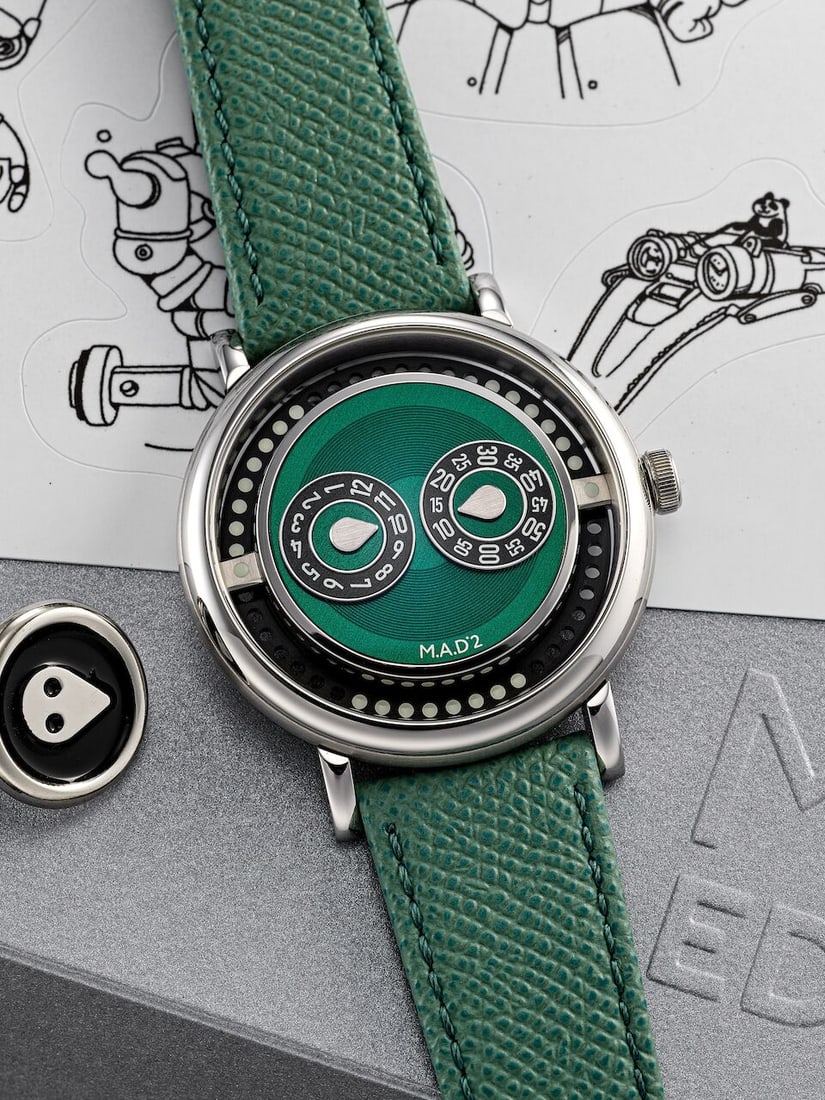 MB&F X M.A.D. EDITIONS | M.A.D.2 'GREEN', A BRAND NEW PLAYFUL STAINLESS STEEL JUMPING HOUR WRIST...: MB&F X M.A.D. EDITIONS | M.A.D.2 'GREEN', A BRAND NEW PLAYFUL STAINLESS STEEL JUMPING HOUR WRISTWATCH WITH ROTATING BEADED ROTOR, CIRCA 2025 Case No: M02S6347 Calibre: G101, automatic, signed Dial: