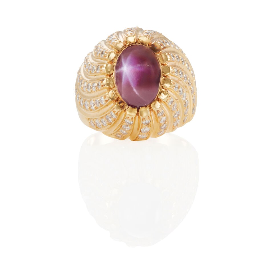 18K GOLD, DIAMOND AND STAR SAPPHIRE RING: 18K GOLD, DIAMOND AND STAR SAPPHIRE RING • 18k yellow gold • Numerous round diamonds weighing approximately 1.15 - 1.25 carat total • 1 oval star sapphire cabochon weighing approxima