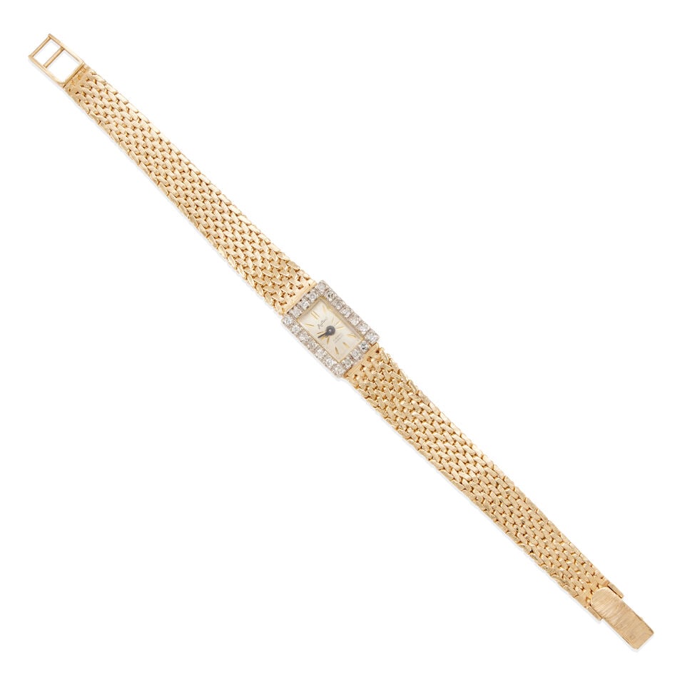 AUSTIN: 14K BICOLOR GOLD AND DIAMOND WRISTWATCH: AUSTIN: 14K BICOLOR GOLD AND DIAMOND WRISTWATCH • 14k yellow and white gold • 20 round single diamonds weighing approximately 0.35 - 0.45 carats total • Signed 'AUSTIN' • Case
