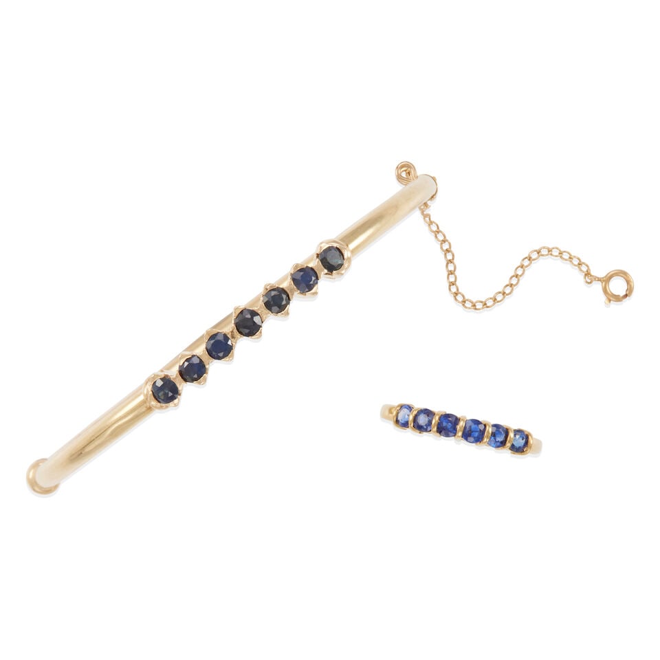 GOLD AND SAPPHIRE SET: GOLD AND SAPPHIRE SET • One hinged bangle bracelet of 14k yellow gold with 7 round sapphires weighing approximately 0.95 - 1.05 carat total, inner circumference 6 1/2 in. • One ring of