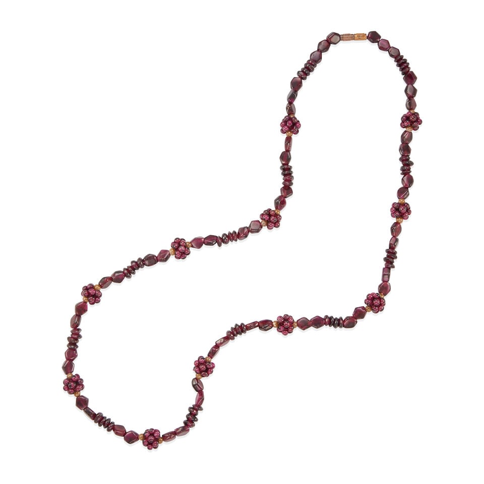 GARNET BEAD NECKLACE: GARNET BEAD NECKLACE • Base metal clasp • Numerous garnet beads of varying shapes and sizes 3.00 - 9.00mm • Length 25 1/2 in. • Estimated gross weight: 51.0 grams Footnotes: Ov