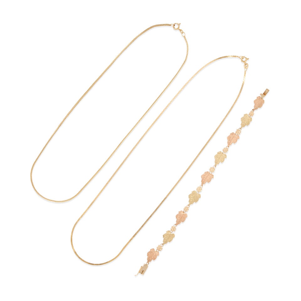 GROUP OF GOLD JEWELRY: GROUP OF GOLD JEWELRY • Two chains of 14k yellow gold, lengths 16 1/4 and 18 1/2 in., estimated weight 7.9 grams • One bracelet of 10k rose and yellow gold, measures 7 in., estimated weigh