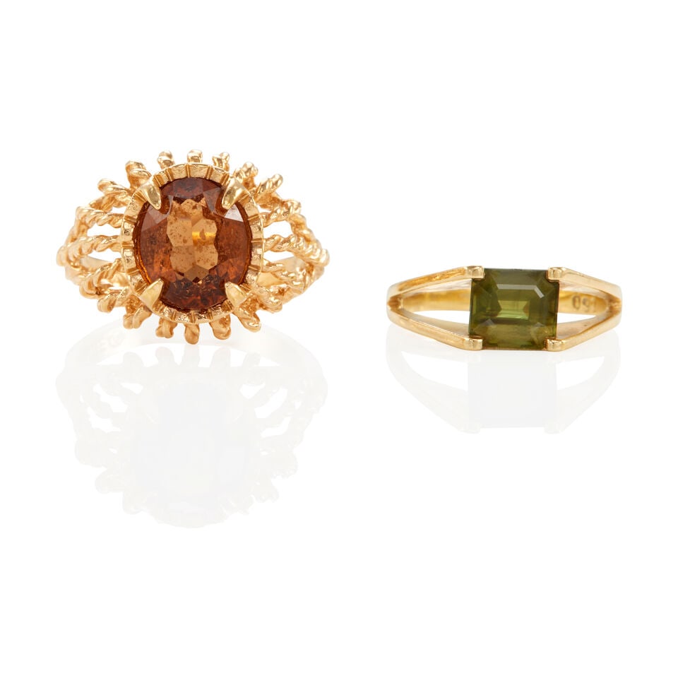 TWO GEM-SET RINGS: TWO GEM-SET RINGS • 18k yellow gold ring with 1 rectangle shape green stone measuring 6,67 x 5.58 x 4.11 mm, size 5 ¼ • 18k yellow gold electroplate ring with 1 oval shape glass measu