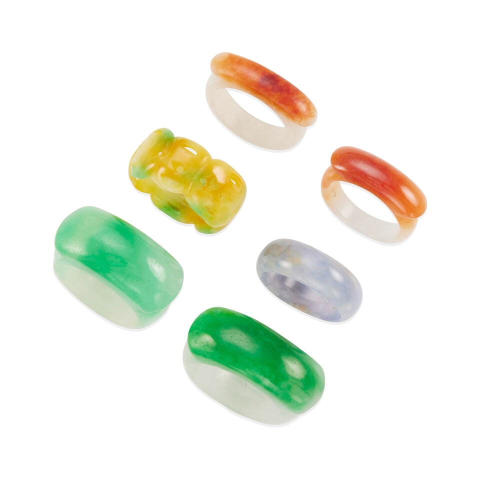 GROUP OF SIX MULTI-COLOR JADE BAND RINGS: GROUP OF SIX MULTI-COLOR JADE BAND RINGS • Carved and saddle rings in green, lavender, yellow, red and white jade • Sizes 7 3/4 to 11 1/2, widths 12.85 to 6.00 mm • Estimated gross
