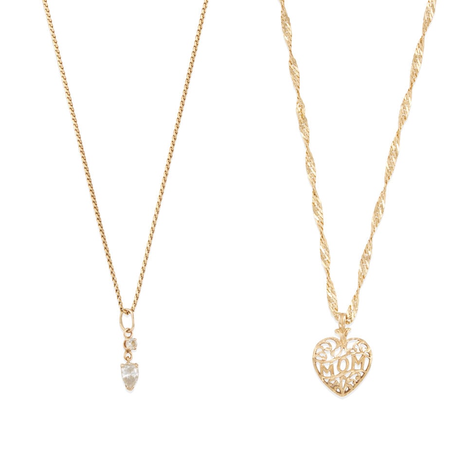 TWO GOLD NECKLACES: TWO GOLD NECKLACES • One chain necklace of 18k yellow gold with 14k yellow gold pendant and 2 pear-shaped and round diamonds weighing approximately 0.40 - 0.50 carat total, length 20