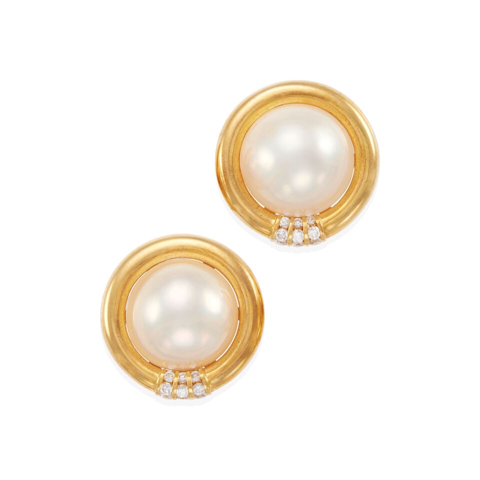 18K GOLD, MABE' CULTURED PEARL, AND DIAMOND EAR CLIPS: 18K GOLD, MABE' CULTURED PEARL, AND DIAMOND EAR CLIPS • 18k yellow gold • 2 hemispherical Mabe' cultured pearls measuring 17.30 mm each in diameter • 18 round diamonds weighing