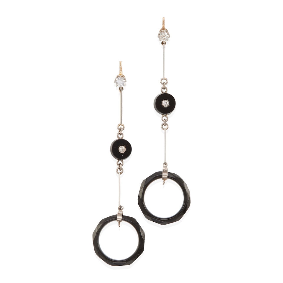 PAIR OF 14K BICOLOR GOLD, DIAMOND, AND ONYX EARRINGS: PAIR OF 14K BICOLOR GOLD, DIAMOND, AND ONYX EARRINGS • 14k yellow and white gold • 4 Old European and round diamonds weighing approximately 0.20 - 0.25 carats total • 2 round ring