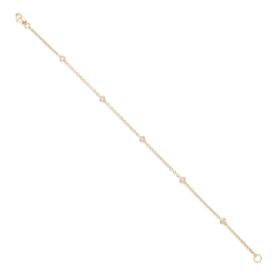 14K GOLD AND DIMAOND STATION BRACELET: 14K GOLD AND DIMAOND STATION BRACELET • 14k yellow gold • 5 round diamonds weighing approximately 0.15 - 0.25 carat total • Length 7 in. • Estimated gross weight: 1.8