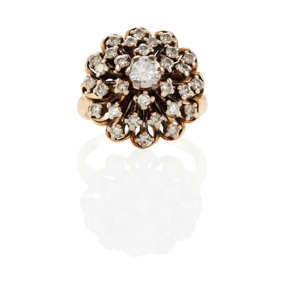 14K BICOLOR GOLD AND DIAMOND CLUSTER RING: 14K BICOLOR GOLD AND DIAMOND CLUSTER RING • 14k yellow and white gold • Numerous round diamonds weighing approximately 0.95 - 1.00 carats total • Size: 6 • Estimated gross