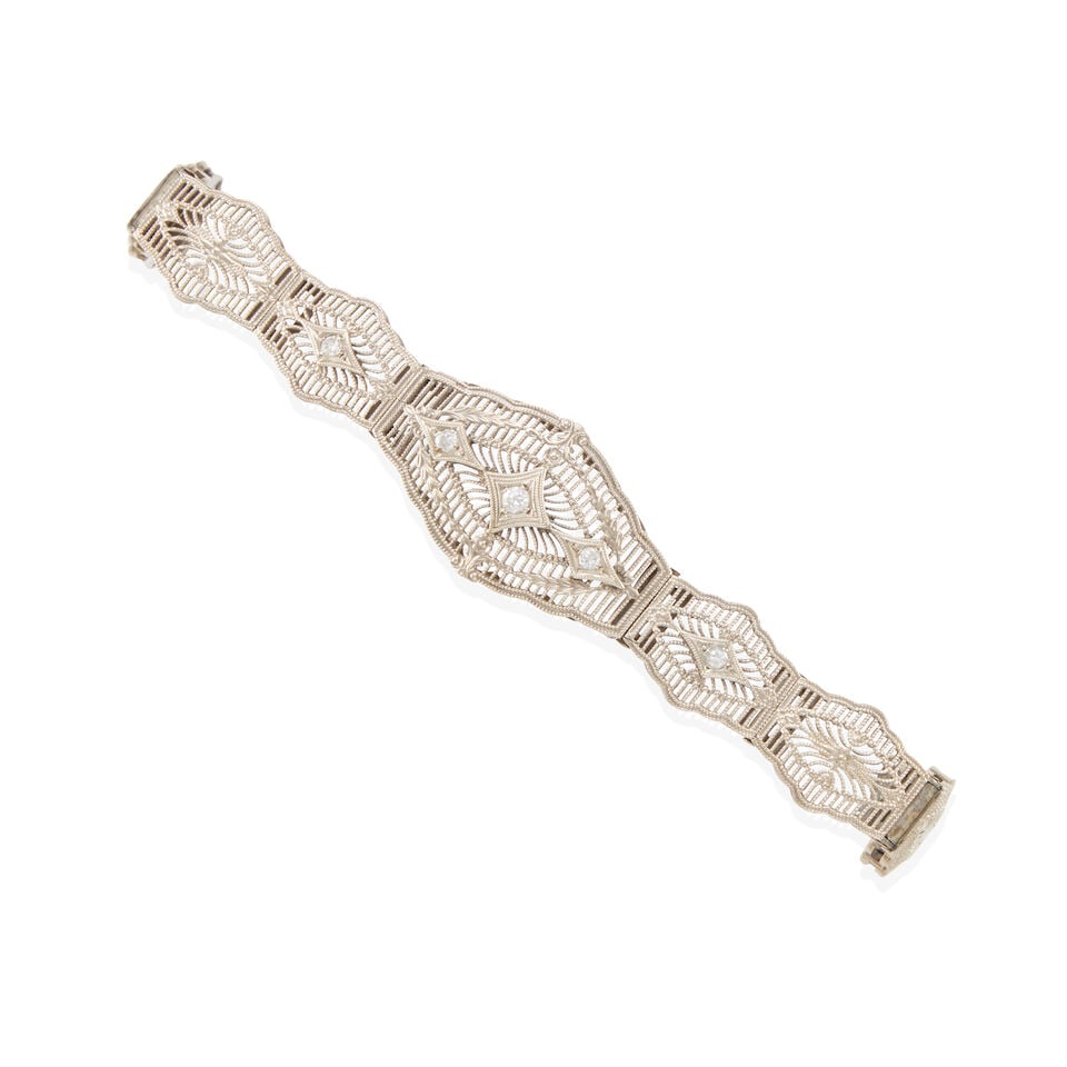14K WHITE GOLD AND DIAMOND ANTIQUE BRACELET: 14K WHITE GOLD AND DIAMOND ANTIQUE BRACELET • 14k white gold • 4 round diamonds weighing approximately 0.10 - 0.15 carats total • Length: 7 in • Estimated gross weight: 8.3