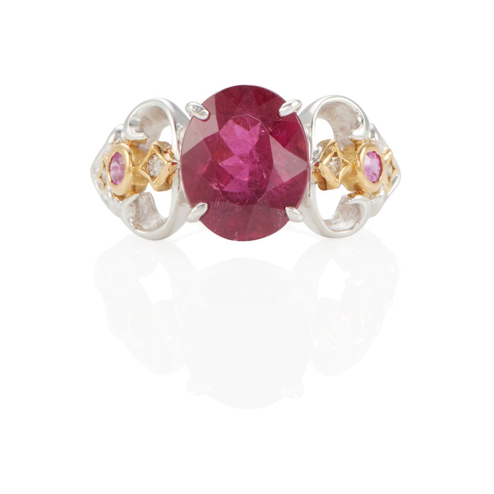 18K BICOLOR GOLD, TOURMALINE, SAPPHIRE, AND FANCY COLOR DIAMOND RING: 18K BICOLOR GOLD, TOURMALINE, SAPPHIRE, AND FANCY COLOR DIAMOND RING • 18k white and yellow gold • 1 oval shape tourmaline weighing approximately 3.35 -3.40 carats (11.10 x 9.00 x 5.58