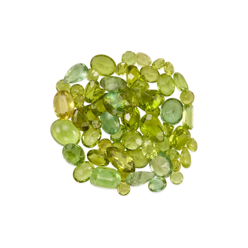 GROUP OF LOOSE PERIDOTS: GROUP OF LOOSE PERIDOTS • Numerous varying shapes and cuts of peridot weighing 122.45 carats total Footnotes: Overall condition, very good Superficial wear in the form of minor scratches and