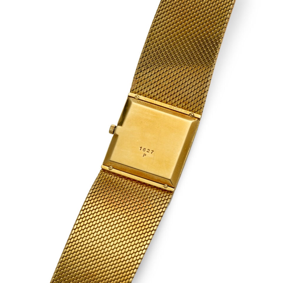 KUTCHINSKY. AN 18K GOLD MANUAL WIND BRACELET WATCH WITH LAPIS LAZULI DIALc. 1970s - 2