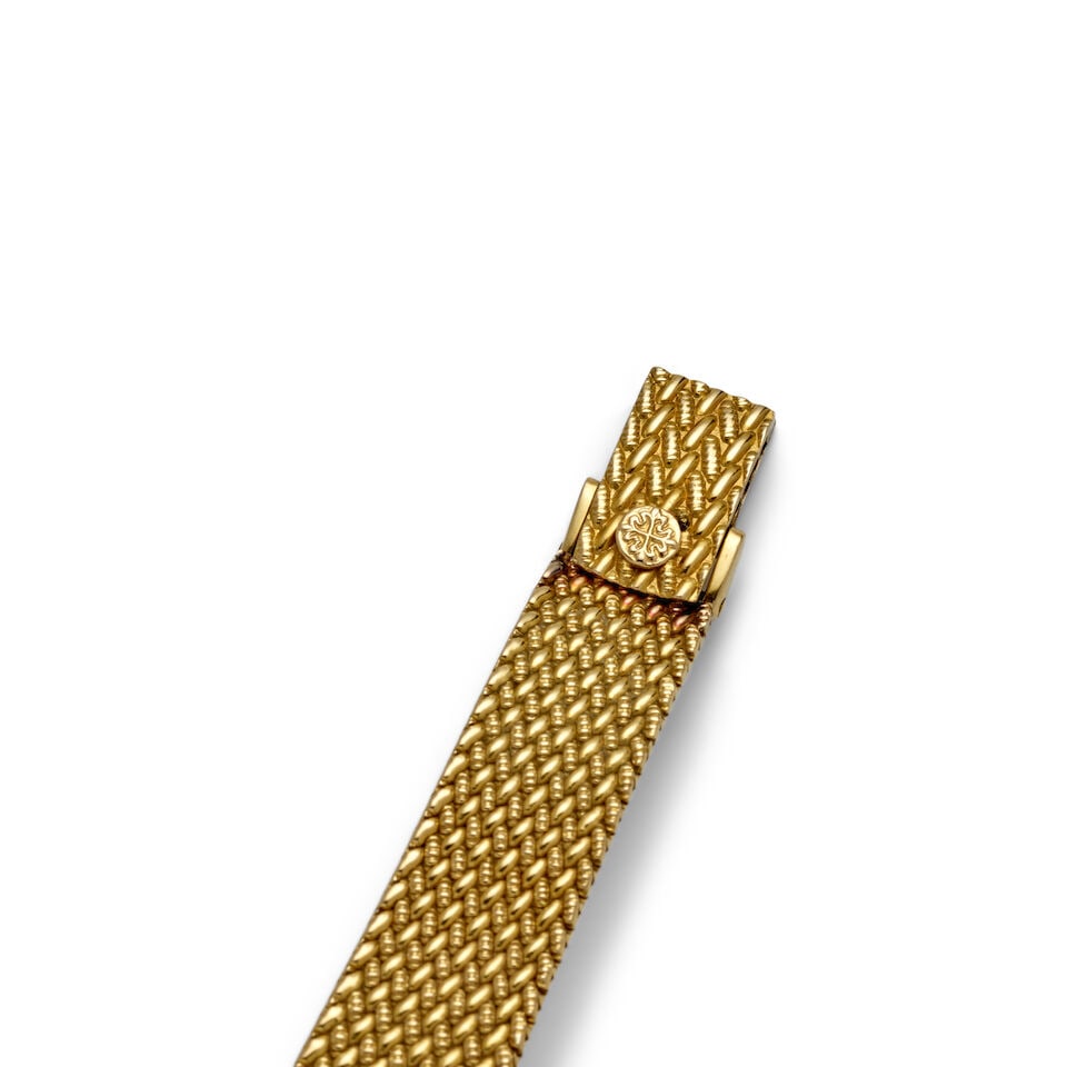 PATEK PHILIPPE. AN 18K GOLD AND DIAMOND SET MANUAL WIND BRACELET WATCHRef: 4459J, c. 1980s - 2