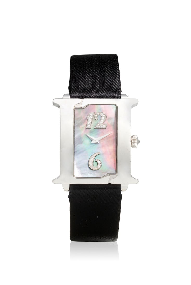LEVIEV. AN 18K WHITE GOLD QUARTZ WRISTWATCH WITH DIAMOND SET AND MOTHER OF PEARL DIAL Double Ell...: LEVIEV. AN 18K WHITE GOLD QUARTZ WRISTWATCH WITH DIAMOND SET AND MOTHER OF PEARL DIAL Model: Double Elle Date: c. 2010s Movement: 5-jewel quartz Dial: Mother of pearl, diamond set hour markers at 12