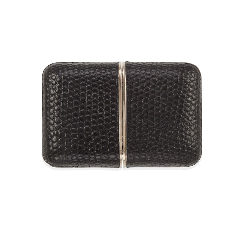 TIFFANY & CO.: LEATHER TRAVEL WATCH CLOCK: TIFFANY & CO.: LEATHER TRAVEL WATCH CLOCK • Steel and embossed leather • Dial signed Tiffany & Co. • Quartz movement, currently not running • Case measures 56 x 37 mm •