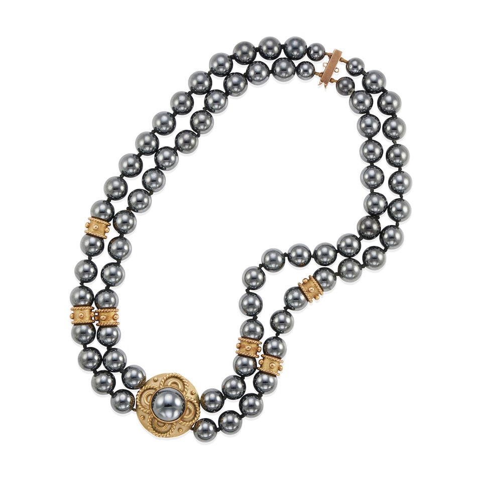 9K GOLD AND HEMATITE DOUBLE STRAND NECKLACE: 9K GOLD AND HEMATITE DOUBLE STRAND NECKLACE • 9k yellow gold • Numerous round hematite beads 8.24 - 10.11mm • Maker's mark • Length 16 1/2 in. • Estimated gross weight: