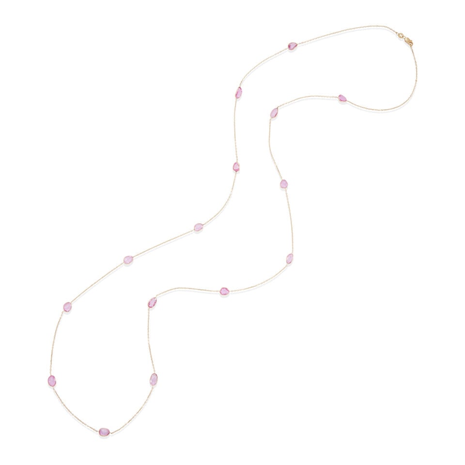 14K GOLD AND PINK SAPPHIRE STATION NECKLACE: 14K GOLD AND PINK SAPPHIRE STATION NECKLACE • 14k yellow gold • 15 oval, pear shape and baroque shape pink sapphires, weighing approximately 8.30 to 8.40 carats total • Length: 36