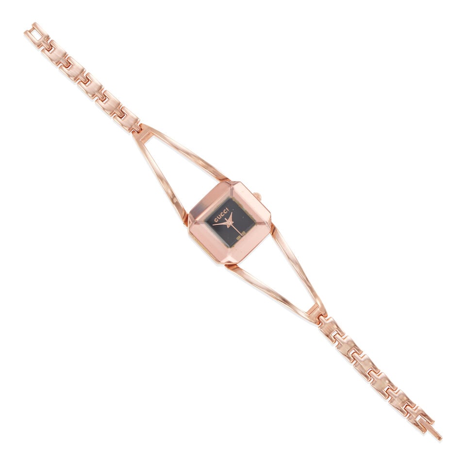 GUCCI: WRISTWATCH: GUCCI: WRISTWATCH • Gold-plated base metal • Dial and case signed Gucci • Quartz movement, currently not working • Case measures 24.07 x 23.07 mm • Length 7 1/2