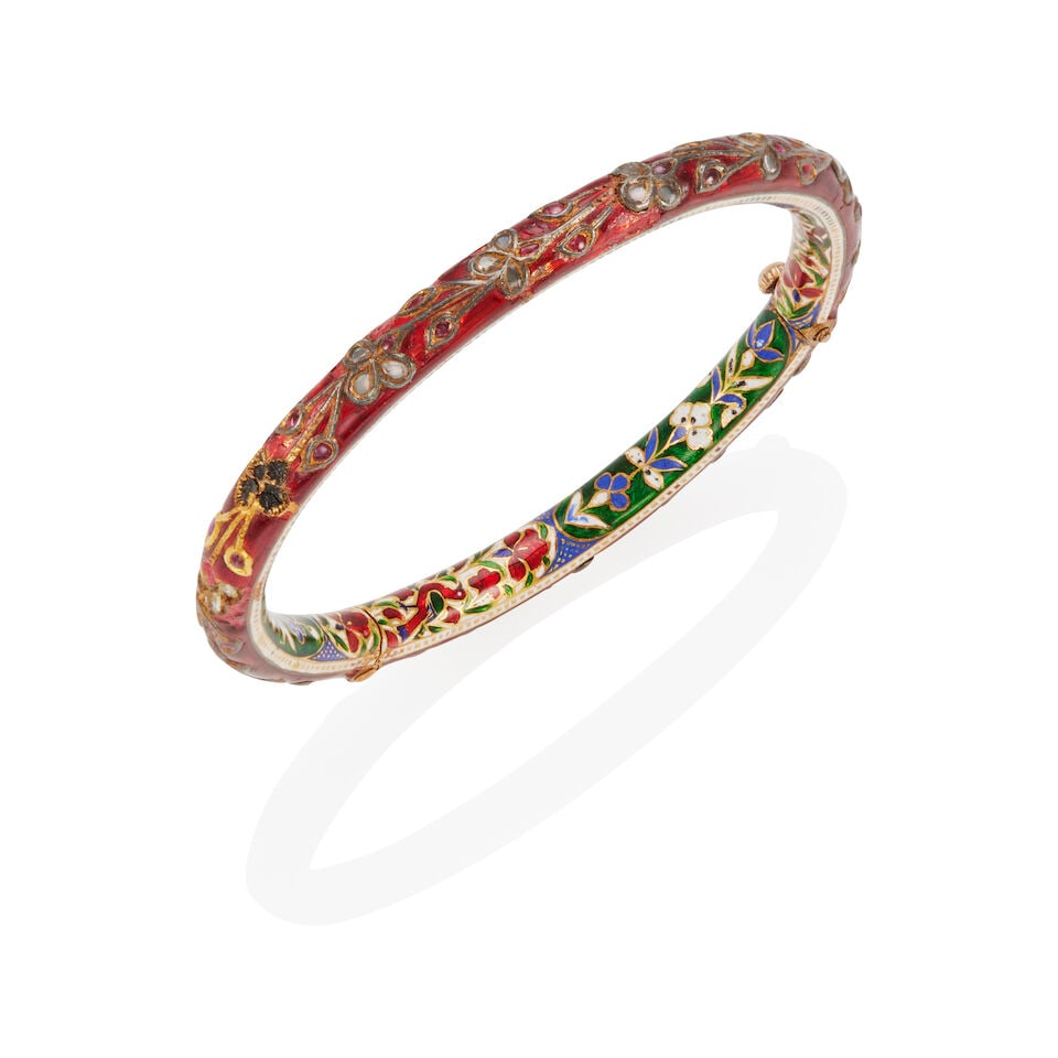 14K GOLD, 'POLKI' DIAMOND AND ENAMEL BANGLE BRACELET: 14K GOLD, 'POLKI' DIAMOND AND ENAMEL BANGLE BRACELET • 14k yellow gold • Numerous 'polki' diamonds • Numerous cabochon rubies • Enamel • Inner circumference 7 1/4