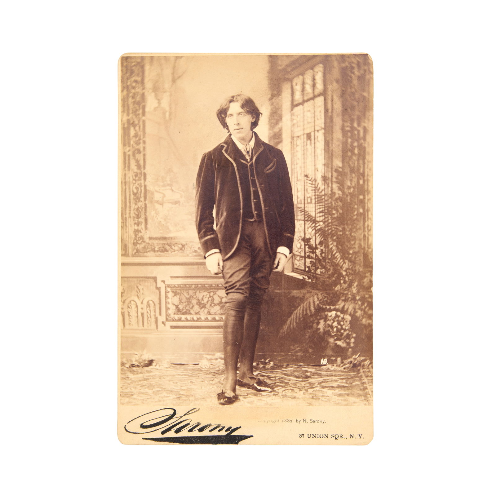 SARONY (NAPOLEON) Cabinet card photograph of Oscar Wilde, taken in New York, 1882: SARONY (NAPOLEON) Cabinet card photograph of Oscar Wilde, taken in New York, full length, albumen print mounted as issued on cabinet card, numbered 10 in the negative, slight scuff to mount above Sar