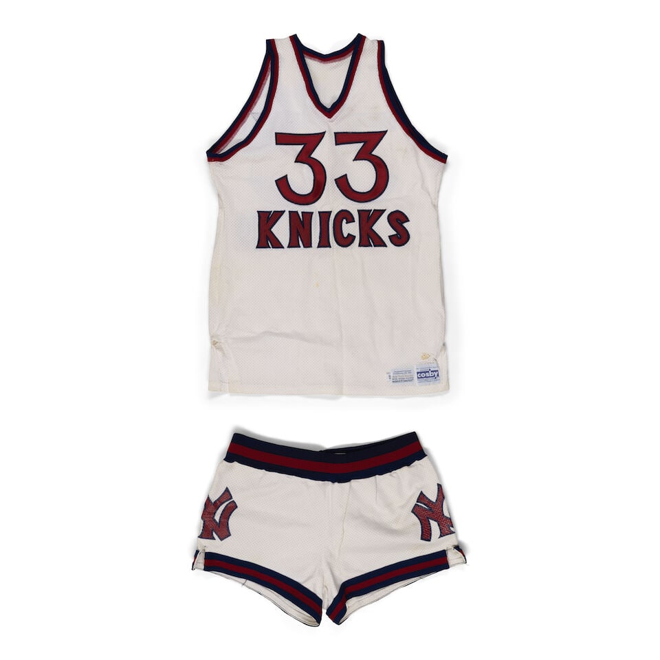 A Sly Williams New York Knicks Game Issue Jersey and ShortsMid-1970s: A Sly Williams New York Knicks Game Issue Jersey and Shorts Mid-1970s Medalist Sand Knit exclusive, size 44 & Gerry Cosby tags. New York, 33 & S. Williams. Footnotes: Condition reports are not provide