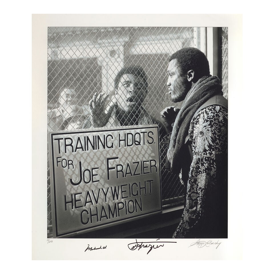 A Pair of Boxing Gloves Signed by Joe Frazier: A Pair of Boxing Gloves Signed by Joe Frazier one signed Joe Frazier, length 10in; width 6in; the other inscribed and signed To George / the best camera man / Joe Frazier, length 10in; width 6 1/2in T