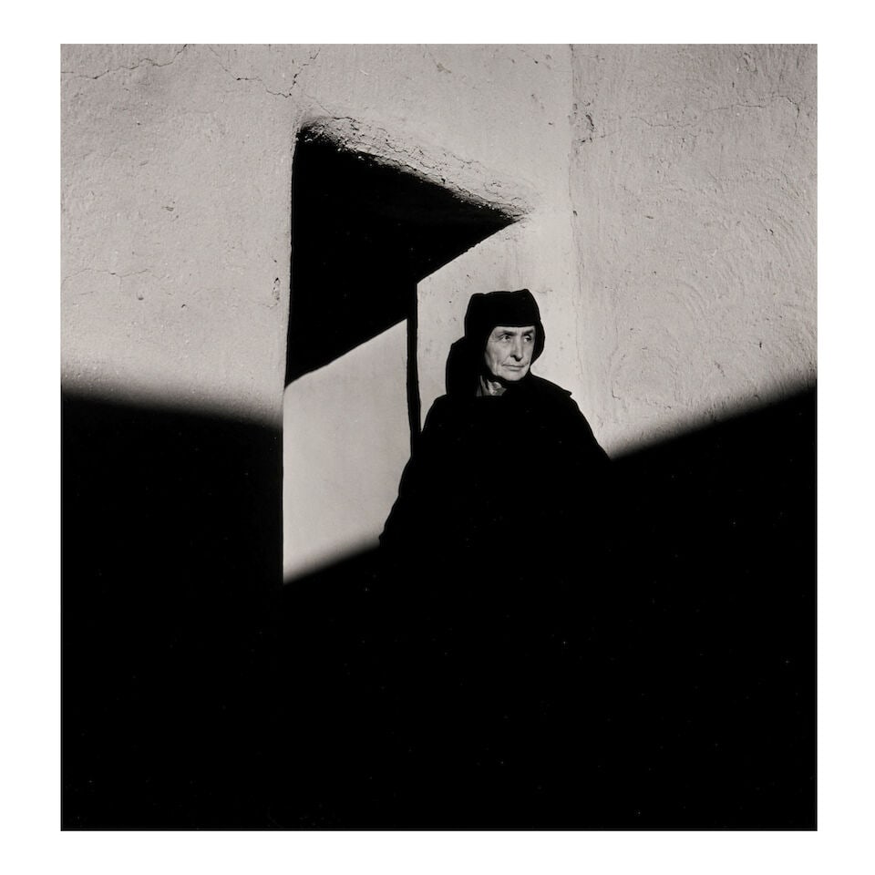 George Daniell (1911-2002); Georgia O'Keeffe at Abiquiu;: George Daniell (1911-2002) Georgia O'Keeffe at Abiquiu, 1952 Gelatin silver print; titled and signed 'Daniell' in pencil and with the photographer's inkstamp on the verso, signed again on the overmat;