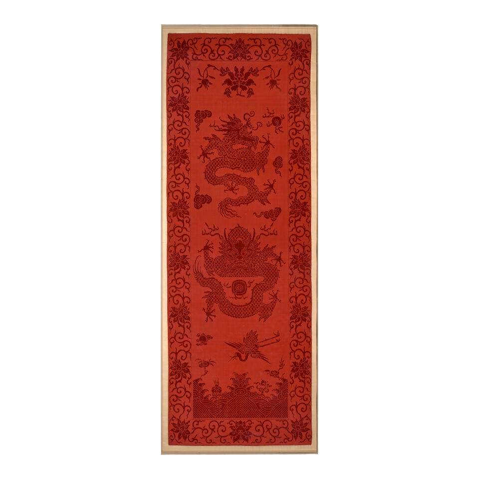 A RED CUT VELVET 'DRAGON' CHAIR COVER 19th century (plexi cover with cloth backing): A RED CUT VELVET 'DRAGON' CHAIR COVER 19th century 66 1/8in x 23 5/8in (168cm x 60cm) (plexi cover with cloth backing). Footnotes: 十九世紀 紅色龍紋