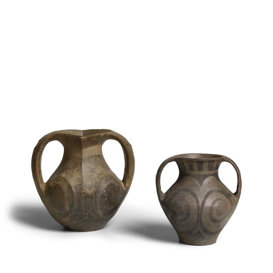 TWO SICHUAN BLACK POTTERY AMPHORAS Warring States/Han Dynasty, 3rd-2nd century B.C. (2): TWO SICHUAN BLACK POTTERY AMPHORAS Warring States/Han Dynasty, 3rd-2nd century B.C. 6in (15.2cm) and 7 1/2in (19cm) high (2). Footnotes: 戰國/漢 紀元前三/