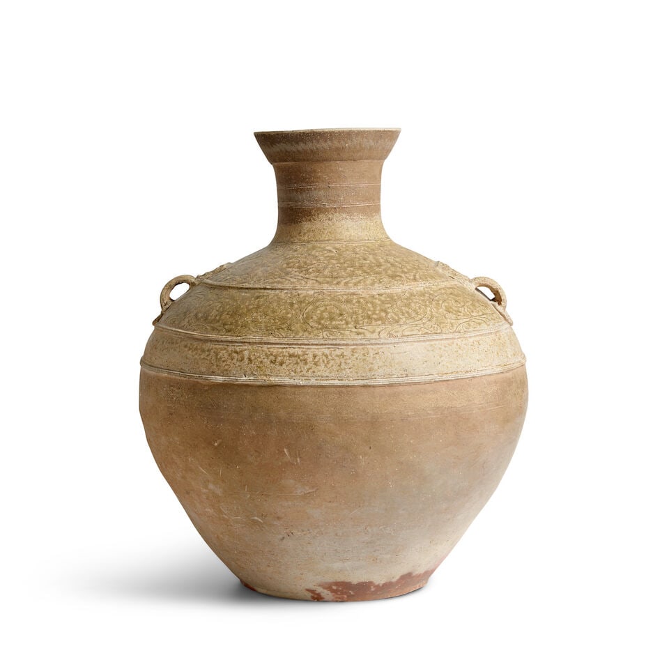 A LARGE ASH-GLAZED STONEWARE HU-FORM JAR WITH LOOP HANDLES Han Dynasty (1 of 3)