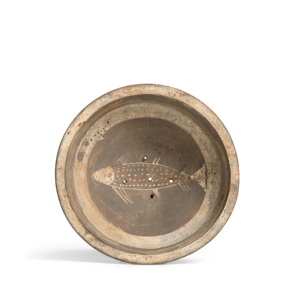 A PAINTED GRAY POTTERY 'FISH' STEAMER TRAY Western Han Dynasty: A PAINTED GRAY POTTERY 'FISH' STEAMER TRAY Western Han Dynasty 7 3/4in (19.7cm) across Footnotes: 西漢 加彩灰陶魚紋蒸盤 Provenance: Alice Bo