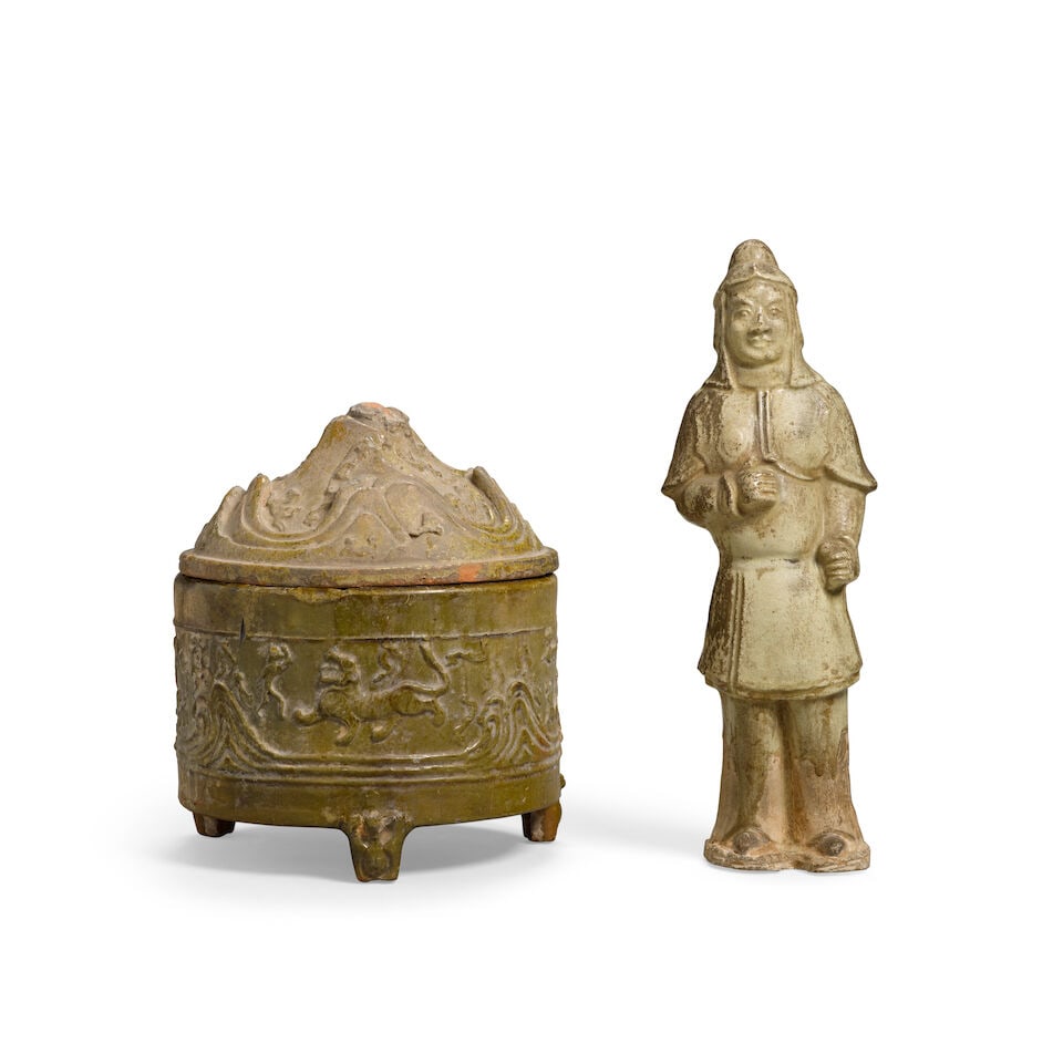 A STRAW-GLAZED POTTERY SOLDIER AND A GREEN-GLAZED POTTERY 'HILL' JAR AND COVER The soldier Sui D... (1 of 1)