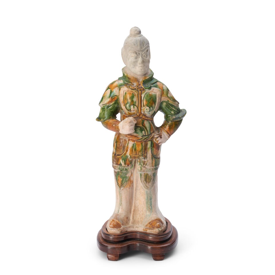 A SANCAI-GLAZED POTTERY STANDING GUARDIAN Tang Dynasty (1 of 2)