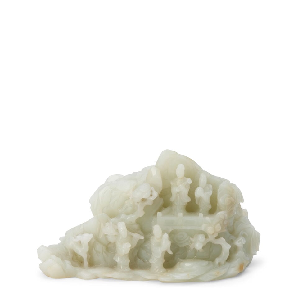 A PALE CELADON AND RUSSET JADE BOULDER 18th/19th century: A PALE CELADON AND RUSSET JADE BOULDER 18th/19th century 5 3/4in (14.6cm) across Footnotes: 十八/十九世紀