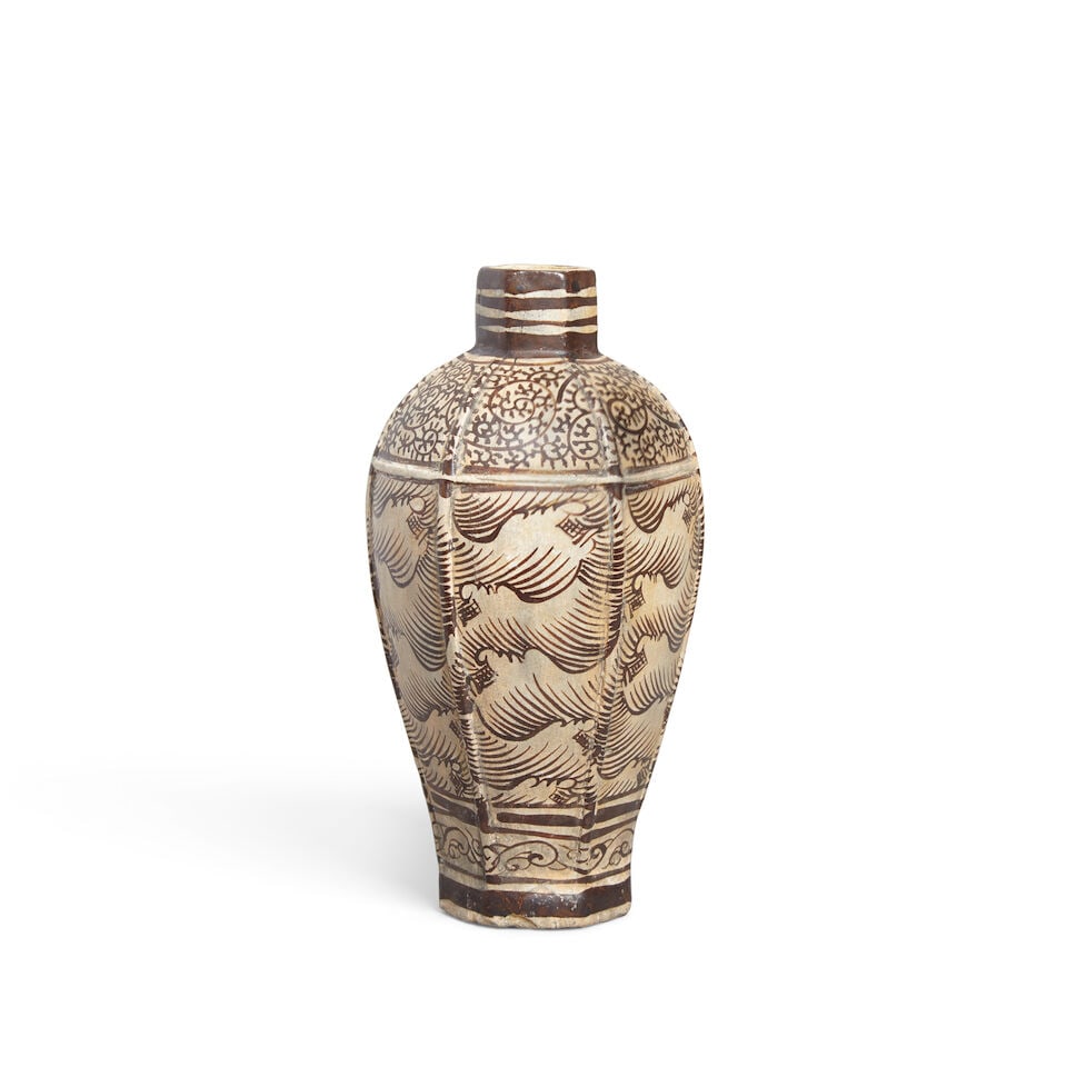 A JIZHOU-STYLE HEXAGONAL 'WAVE' VASE, MEIPING: A JIZHOU-STYLE HEXAGONAL 'WAVE' VASE, MEIPING 7 1/4in (18.4cm) high Footnotes: 仿吉州六方海波紋梅瓶 Please note this Lot is to be sold at