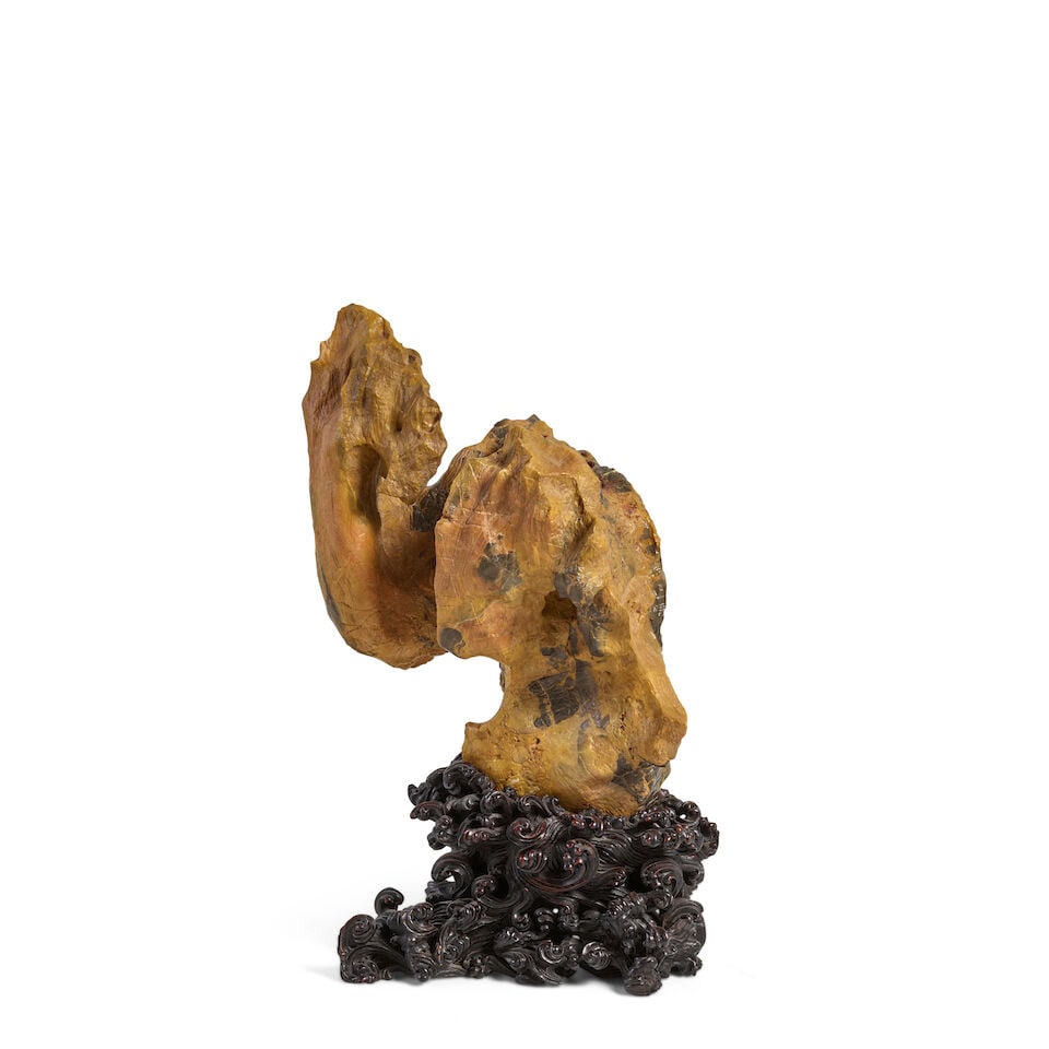 A TERRACOTTA-TONED LINGBI SCHOLAR'S ROCK: A TERRACOTTA-TONED LINGBI SCHOLAR'S ROCK height overall with stand 29in (73.5cm) height of the rock 23in (78.5cm) Footnotes: 淺棕靈璧賞石 Provenance: Tai Sing Co. F