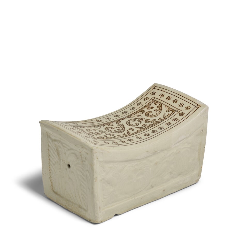 A CIZHOU 'SGRAFFITO' INGOT-SHAPED PILLOW Song Dynasty: A CIZHOU 'SGRAFFITO' INGOT-SHAPED PILLOW Song Dynasty 8 1/2in (21.6cm) across Footnotes: 宋