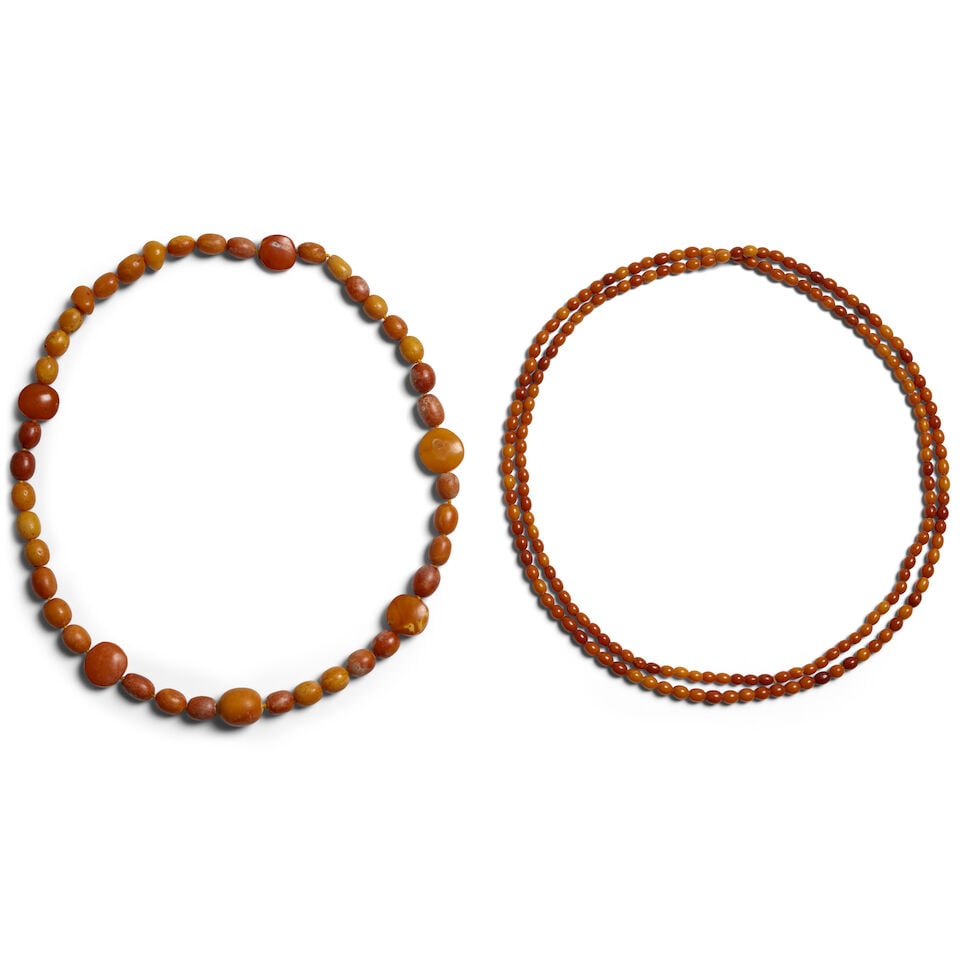 TWO AMBER NECKLACES, ONE WITH GRADUATED BEADS, THE OTHER WITH MINIATURE OVIFORM BEADS (1 of 1)