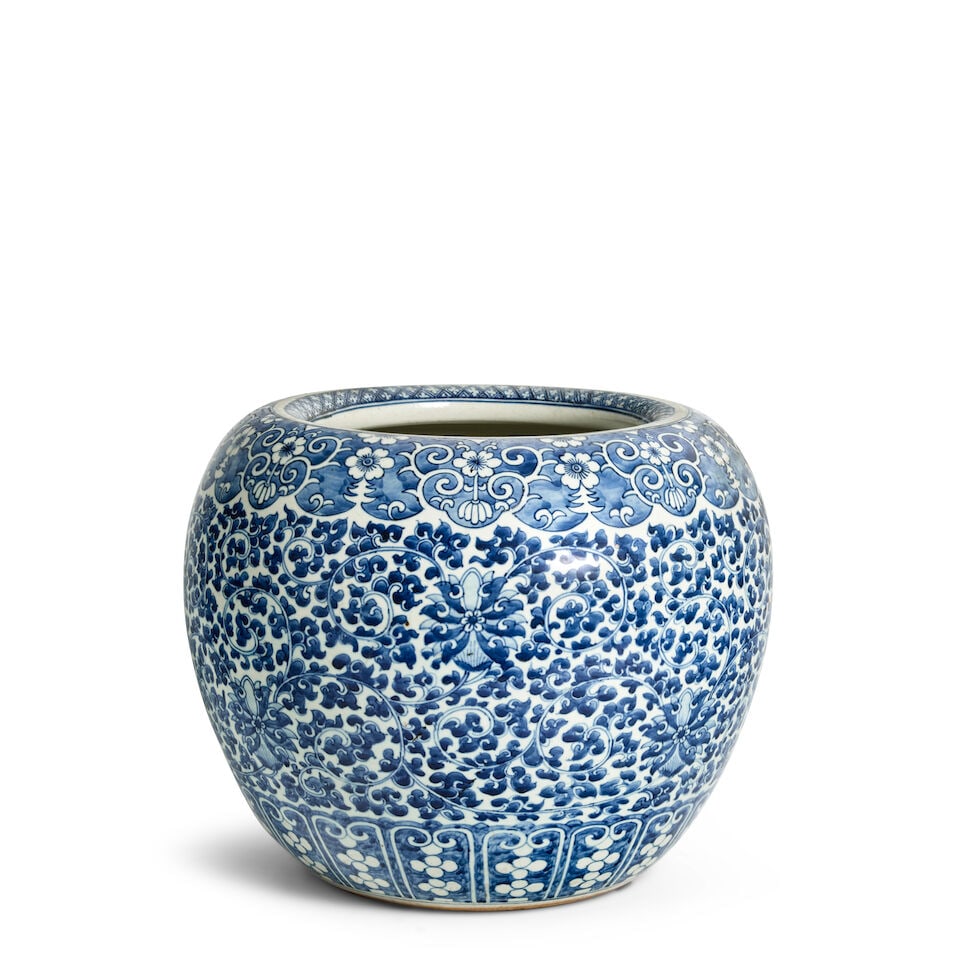 A LARGE BLUE AND WHITE 'LOTUS' JAR WITH INCURVED RIM 18th century: A LARGE BLUE AND WHITE 'LOTUS' JAR WITH INCURVED RIM 18th century 11 1/2in (29.2cm) high Footnotes: 十八世紀 青花纏枝蓮紋大罐 P