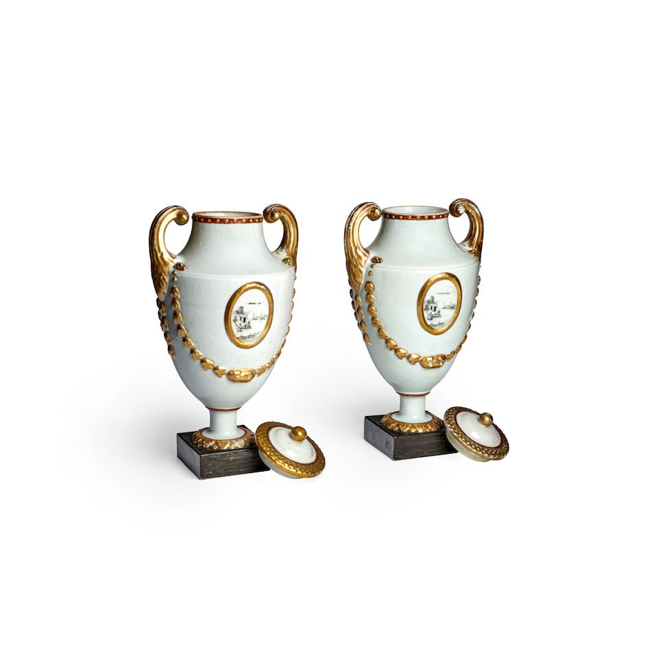 A RARE PAIR OF GILT AND GRISAILLE EUROPEAN-SHAPED PISTOL-HANDLED URNS AND COVERS Late Qianlong/J... - 2